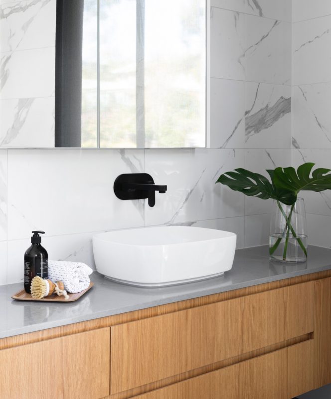 Timber drawers, stone top and white vanity basin for this beautiful bathroom renovation by Star Bathrooms and Renovations, Keppera.